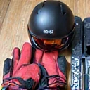 Ski goggles, gloves, and a helmet